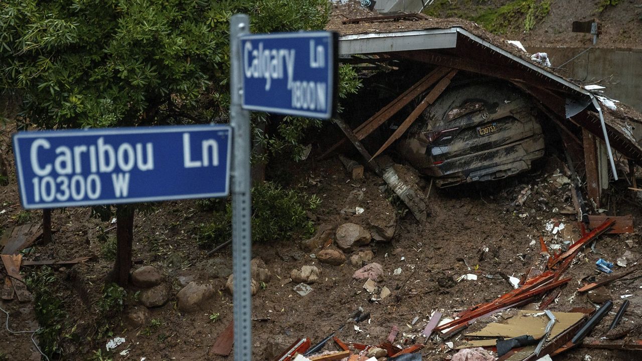 A property sits destroyed by a mudslide during a storm, Tuesday, Feb. 6, 2024, in the Beverly Glen area of Los Angeles. (AP Photo/Ethan Swope)