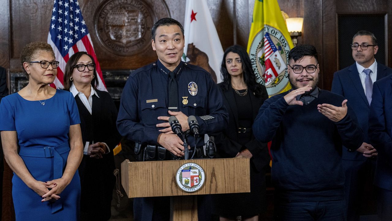 Dominic H. Choi speaks after being named interim chief of the Los Angeles Police Department at City Hall on Wednesday, Feb. 7, 2024, in Los Angeles. Mayor Karen Bass looks on at left. (Gina Ferazzi/Los Angeles Times via AP)