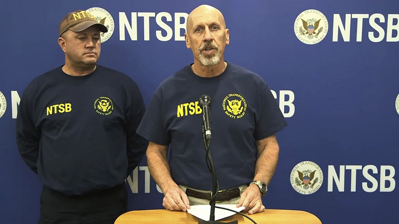 In this image taken from a National Transportation Safety Board video, Michael Graham of the NTSB, which is investigating a deadly helicopter crash that happened in Southern California's Mojave Desert speaks to the media in Barstow, Calif. (National Transportation Safety Board via AP)