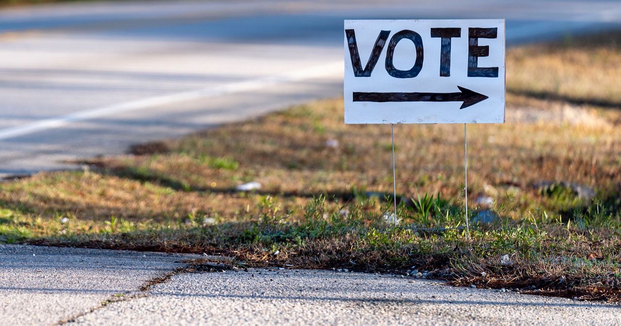 A sign for voting is visible outside the New Bridge Academy on the morning of the South Carolina Republican primary in Cayce, S.C., Saturday, Feb. 24, 2024. (AP Photo/Andrew Harnik)