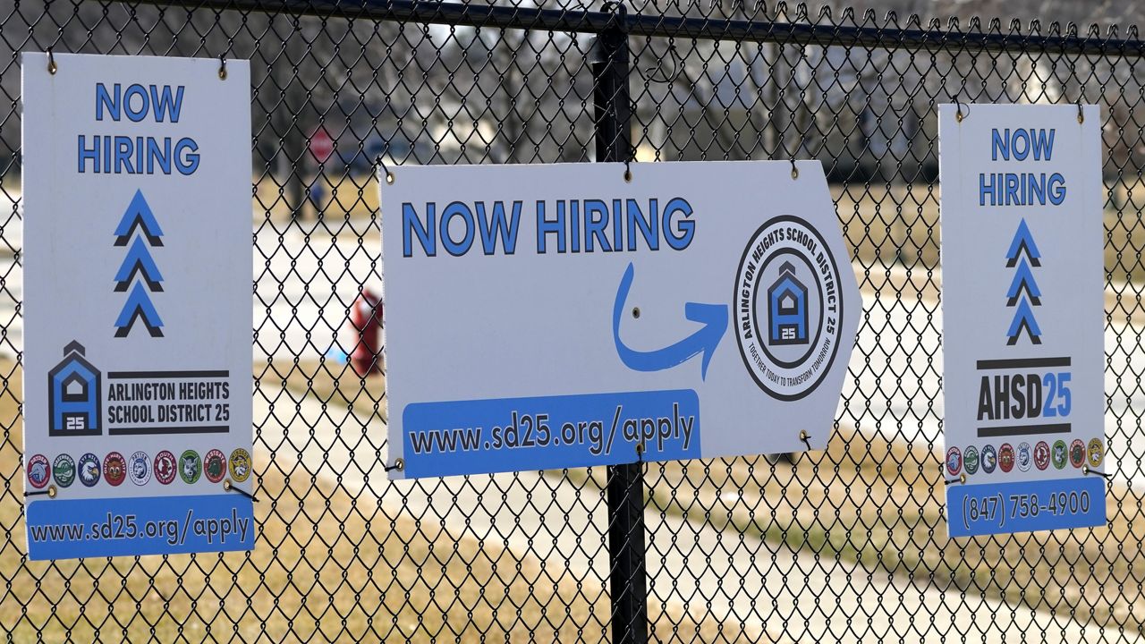 Hiring signs are displayed in Arlington Heights, Ill., Monday, Feb. 26, 2024. (AP Photo/Nam Y. Huh)