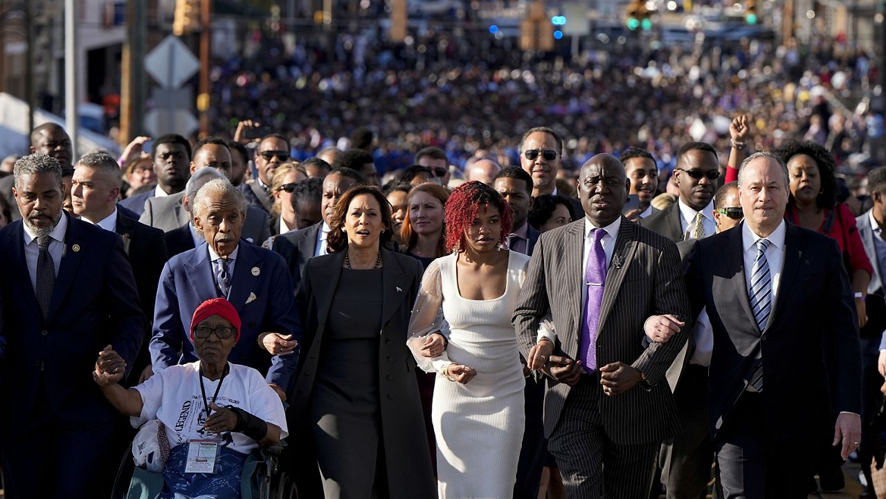 The Rev. Al Sharpton, Vice President Kamala Harris Attorney Ben Crump and the second gentleman of the United States Douglas Emhoff walk with hundreds of people across the Edmund Pettus Bridge with others commemorating the 59th anniversary of the Bloody Sunday voting rights march in 1965, Sunday, March 3, 2024, in Selma, Ala. 