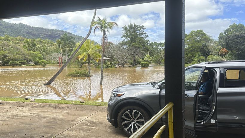 This photo provided by Kauai County shows the flooded Wailua River area near Smith’s Tropical Paradise on Friday, April 12, 2024. (Courtesy of Kauai County, Hawaii via AP)