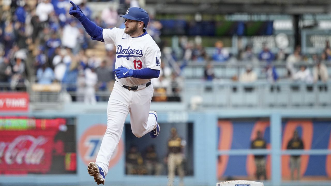 Los Angeles Dodgers third base Max Muncy celebrates after hitting a home run during the fourth inning of a baseball game against the San Diego Padres Sunday, April 14, 2024, in Los Angeles. (AP Photo/Eric Thayer)