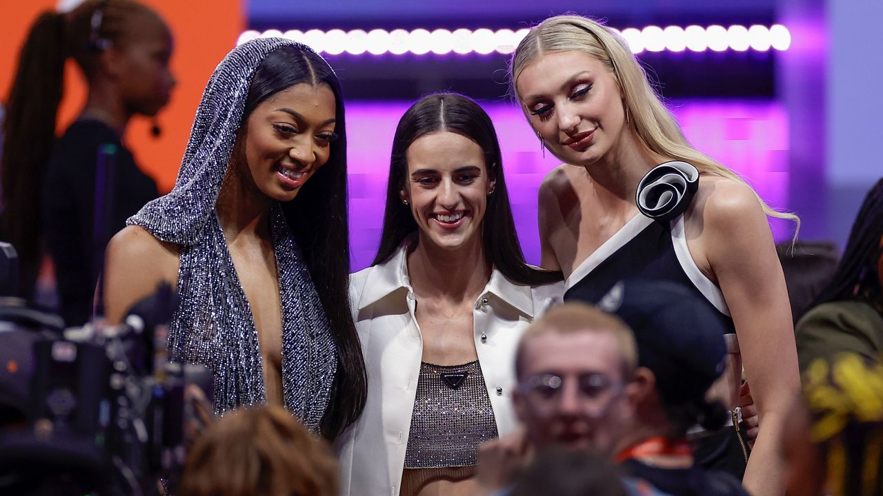 Angel Reese, Caitlin Clark and Cameron Brink pose for a photo before the WNBA basketball draft in Brooklyn on Monday, April 15, 2024.