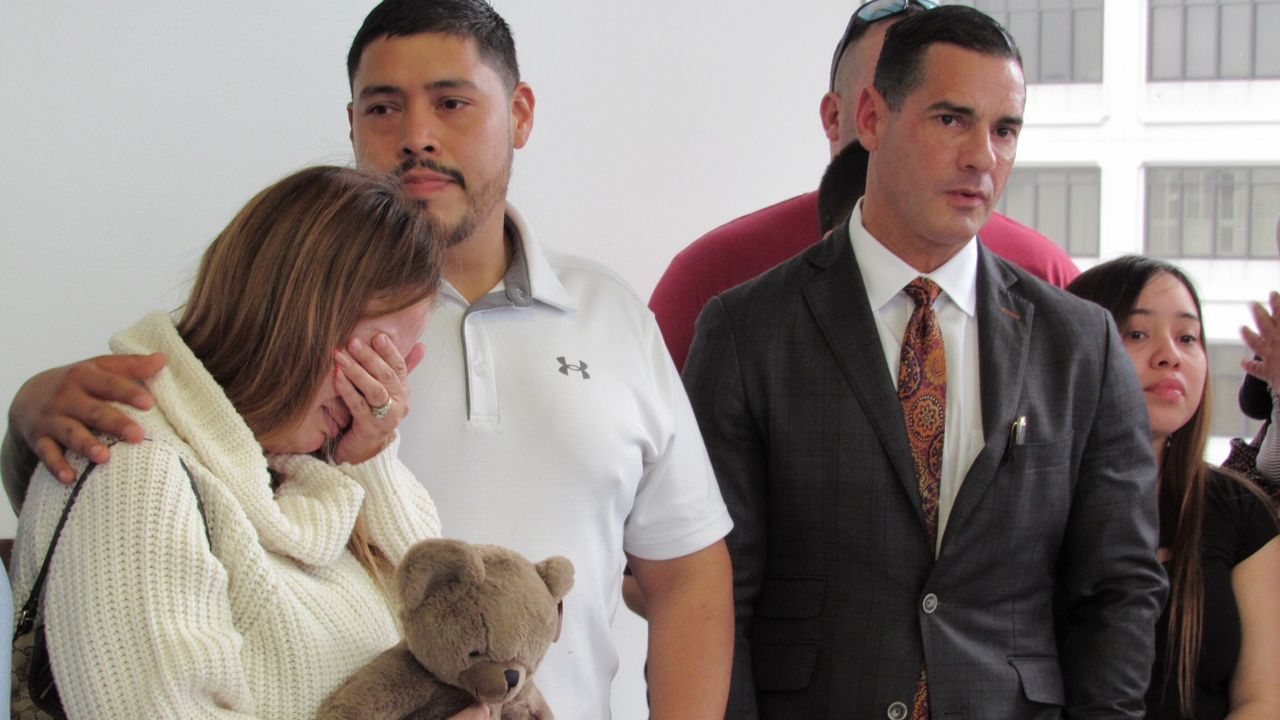 Arlene Alvarez's parents, Gwen Alvarez and Armando Alvarez are seen during a news conference with their attorney, Rick Ramos, right, Wednesday, Feb. 16, 2022 in Houston, Texas. Tony Earls, who is accused of fatally shooting a 9-year-old girl when he was robbed at a Houston ATM in 2022 has been indicted Tuesday, April 23, 2024, for murder in her death. The indictment against Earls comes nearly two years after another grand jury had declined to indict him in the death of Alvarez. (AP Photo/Juan A. Lozano, File)