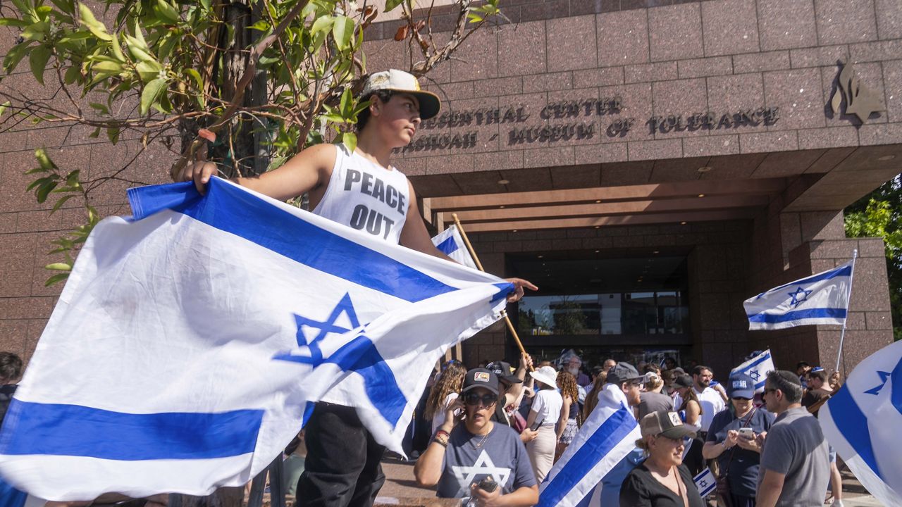  Eldar Avital, 12, left, joins pro-Israel supporters to condemn a violent protest the previous weekend outside Adas Torah synagogue as members of the Jewish community gather at Simon Wiesenthal Center on June 24, 2024, in Los Angeles. U.S. Attorney General Merrick Garland said Thursday, June 27, 2024, that federal officials are investigating the weekend demonstration by opponents of the Israel-Hamas war in Gaza that spiraled into violence. (AP Photo/Damian Dovarganes, File)