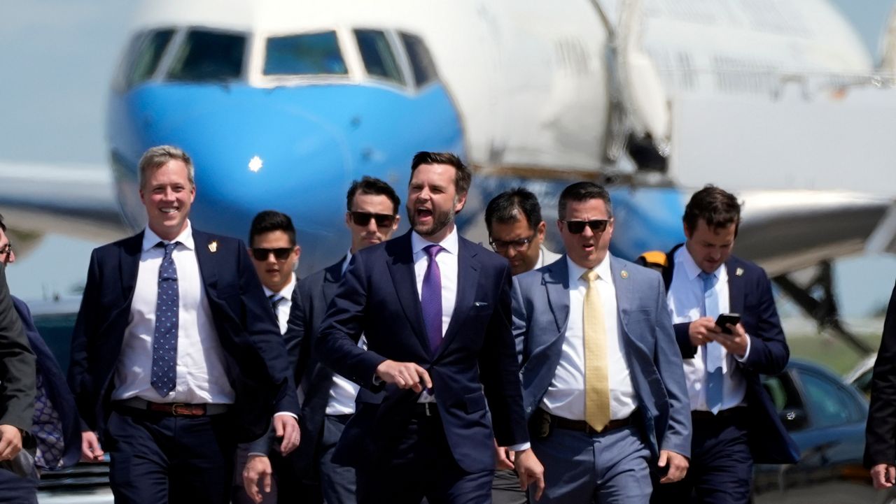 Republican vice presidential nominee Sen. JD Vance, R-Ohio, walks back from looking at Air Force Two at Chippewa Valley Regional Airport, Wednesday, Aug. 7, 2024, in Eau Claire, Wis. (AP Photo/Alex Brandon)