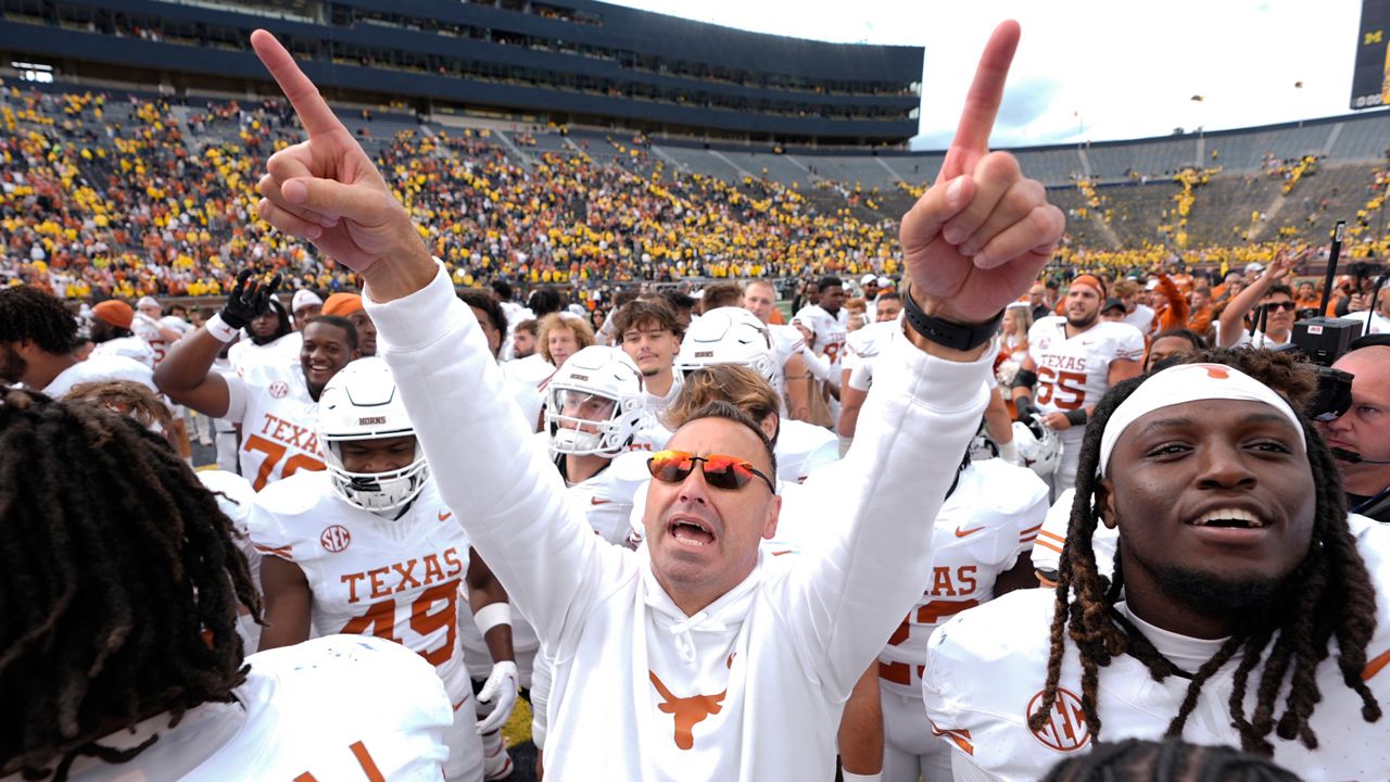 Texas head coach Steve Sarkisian celebrates after in beating Michigan 31-12 in an NCAA college football game in Ann Arbor, Mich., Saturday, Sept. 7, 2024. (AP Photo/Paul Sancya)