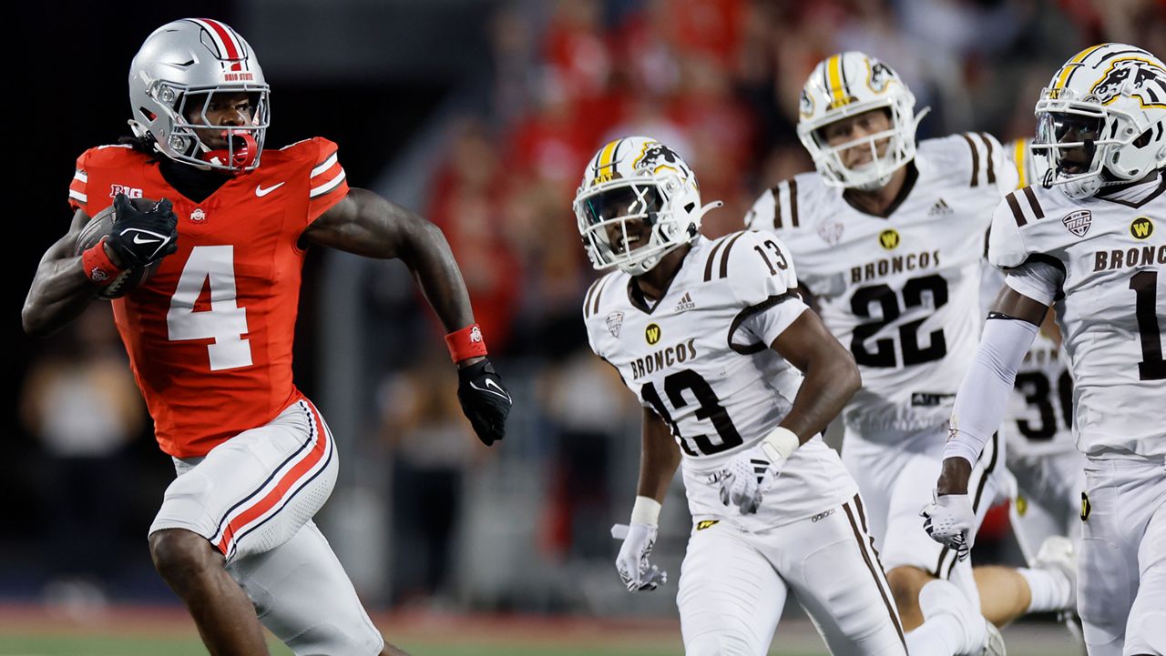 Ohio State receiver Jeremiah Smith, left, outruns the Western Michigan defense to score a touchdown during the first half of an NCAA college football game Saturday, Sept. 7, 2024, in Columbus, Ohio.