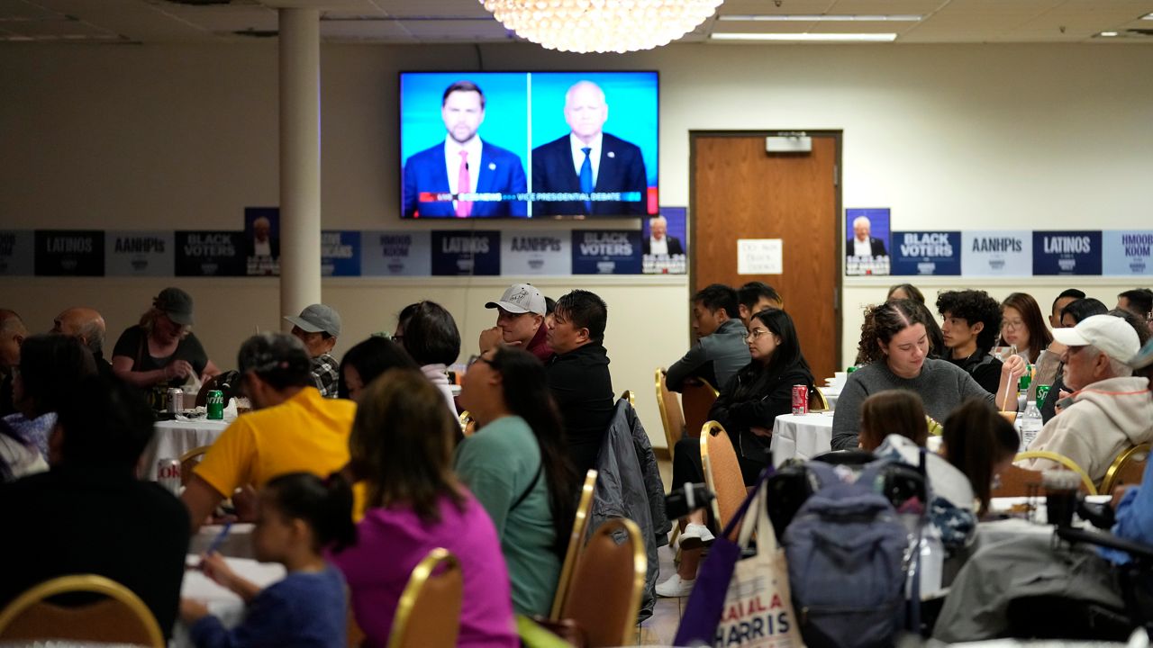 People attend a viewing party for the 2024 Vice Presidential Debate between Gov. Tim Walz and Sen. J.D. Vance at Unison Restaurant and Banquet Tuesday, Oct. 1, 2024, in Maplewood, Minn. (AP Photo/Abbie Parr)