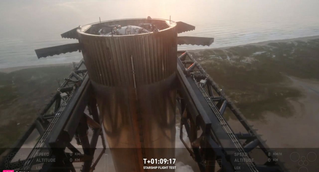 This image provided by SpaceX shows SpaceX's mega rocket booster returning to the launch pad to be captured during a test flight Sunday, Oct. 13, 2024, in Boca Chica, Texas. (SpaceX via AP)