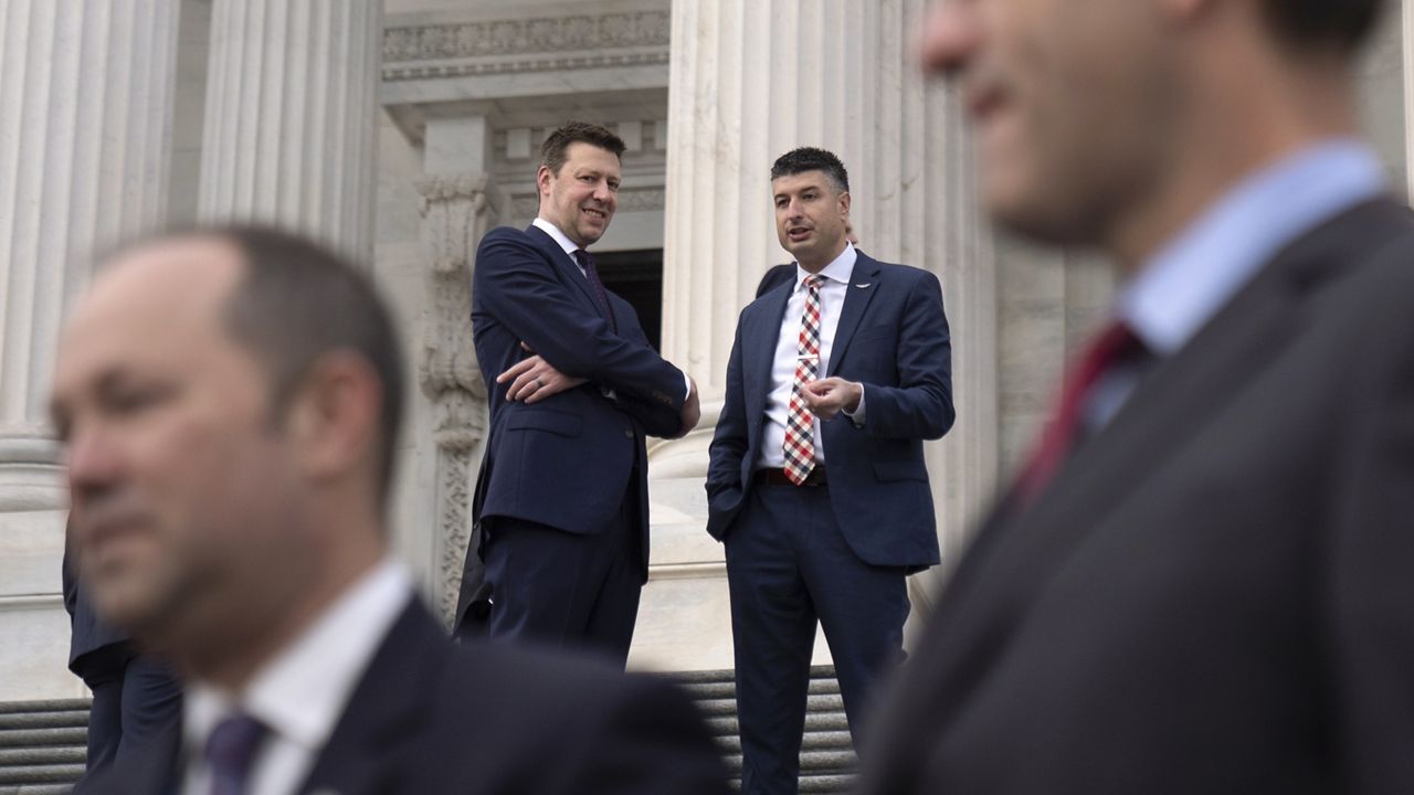 A photo of Josh Riley and fellow Rep.-elect Tom Barrett on the steps of the Capitol.