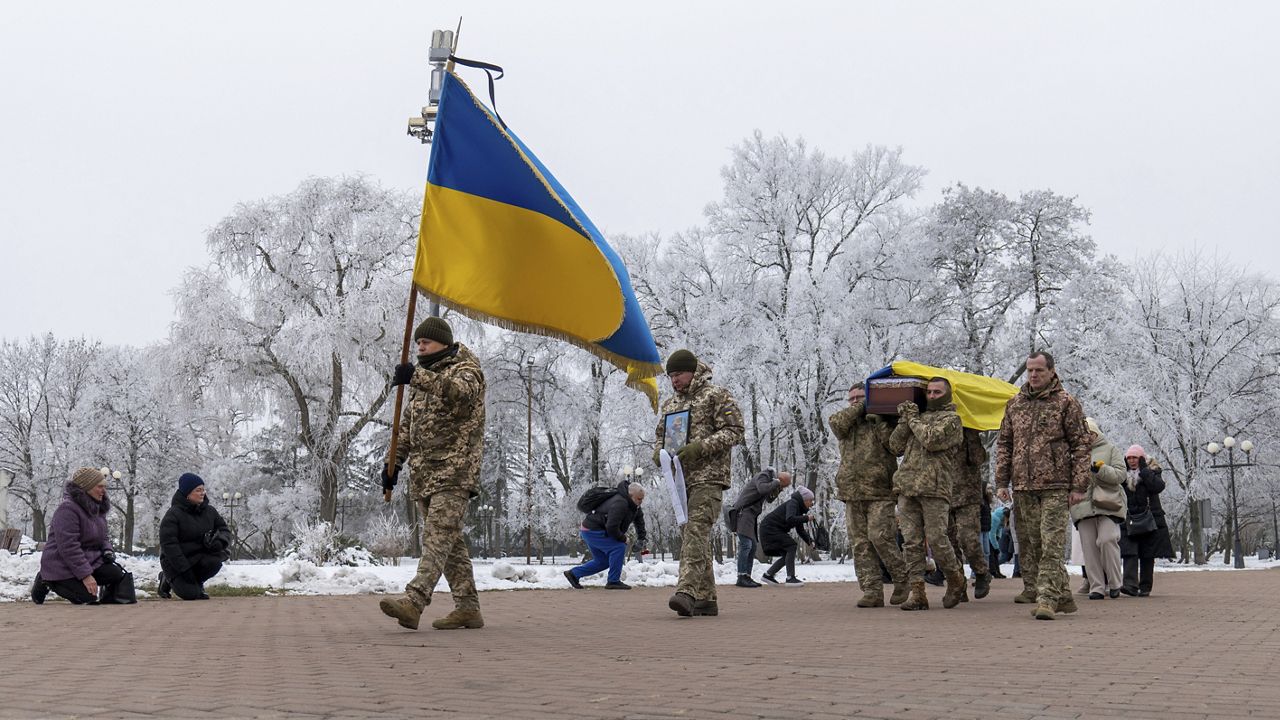 Fellow soldiers carry the coffin of leading actor of the music and drama theatre Petro Velykiy, 48, who was killed in a battle with the Russian troops in Russia's Kursk region, during farewell ceremony in Chernyhiv, Ukraine, Wednesday, Nov. 27, 2024. (AP Photo/Dan Bashakov)