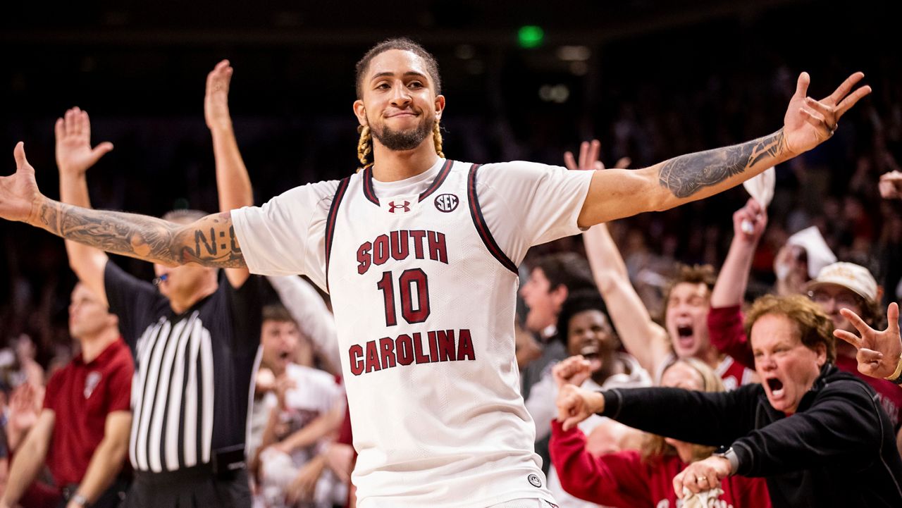 South Carolina Gamecocks guard Myles Stute (10) celebrates a three point basket against the Clemson Tigers during the second half of an NCAA basketball game on Tuesday, Dec. 17, 2024, in Columbia, S.C. (AP Photo/Scott Kinser)