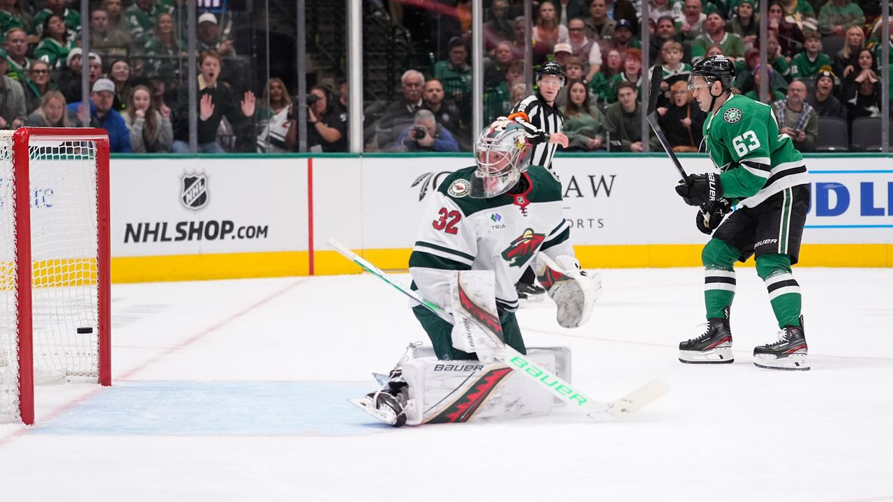 Dallas Stars right wing Evgenii Dadonov (63) scores a goal against Minnesota Wild goaltender Filip Gustavsson (32) during the first period of an NHL hockey game Friday, Dec. 27, 2024, in Dallas. (AP Photo/LM Otero)