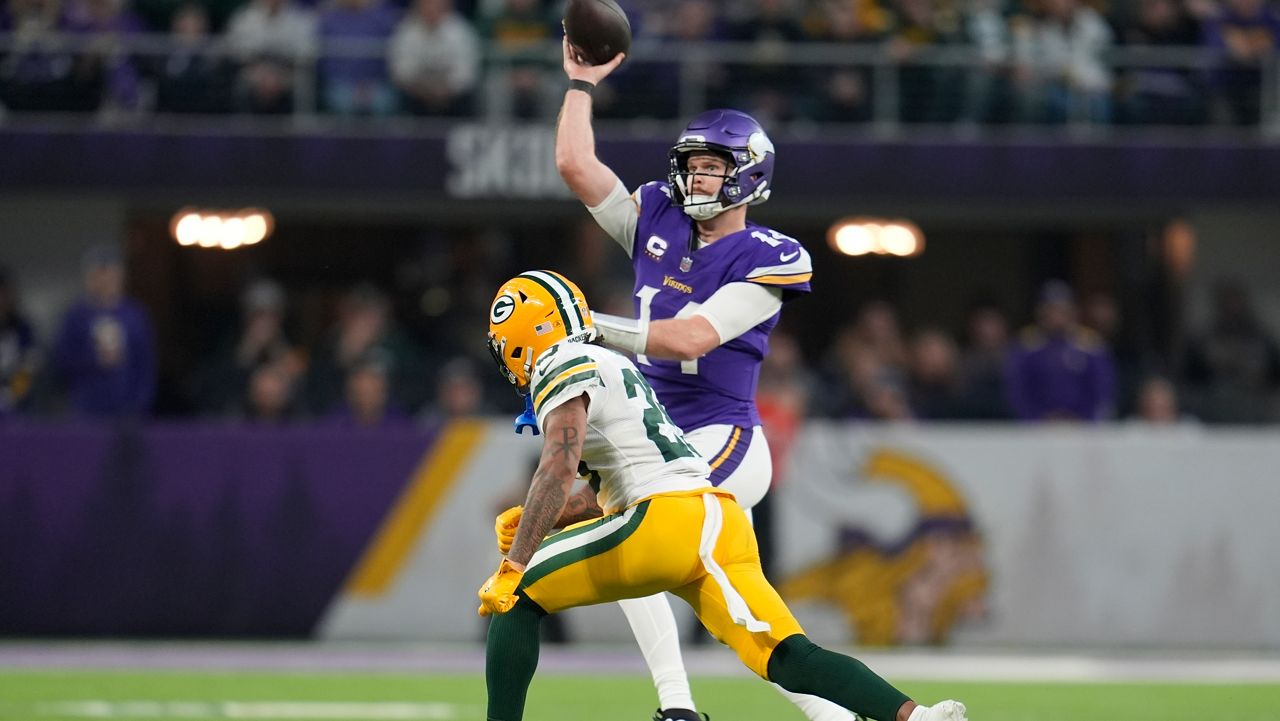 Minnesota Vikings' Sam Darnold throws while being pressured by Green Bay Packers' Keisean Nixon