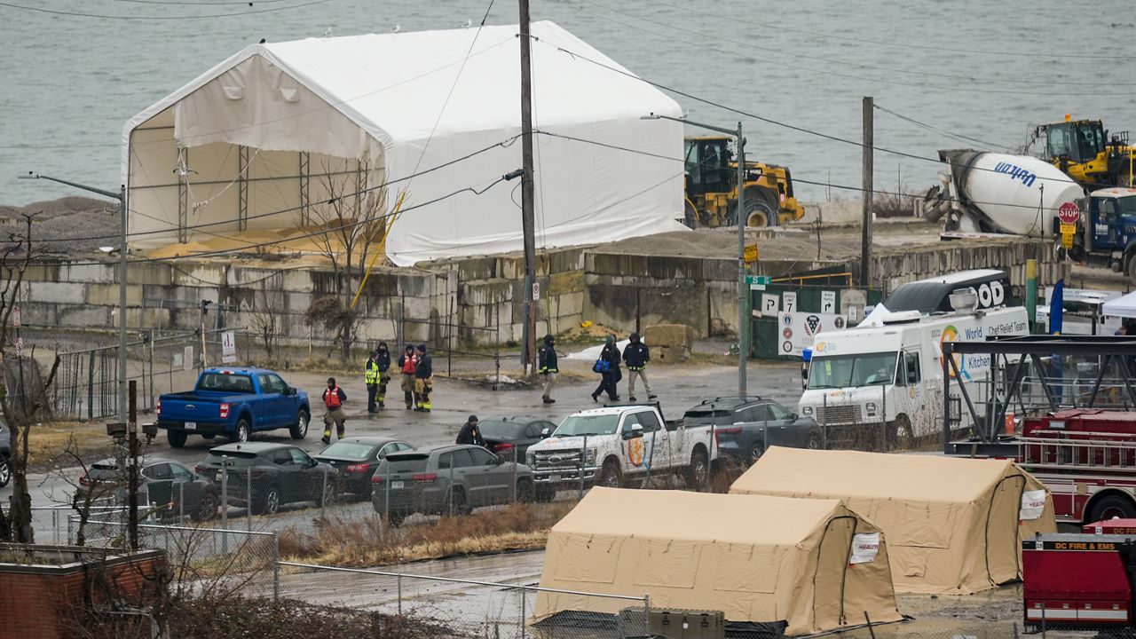 Emergency vehicles and recovery operations are seen near the mouth of the Anacostia River at the Potomac River near Ronald Reagan Washington National Airport, Friday, Jan. 31, 2025, in Washington. (AP Photo/Carolyn Kaster)