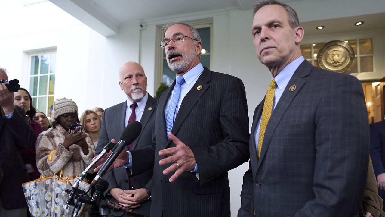 Rep. Chip Roy, R-Texas, left, and Rep. Scott Perry, R- Pa., right, listen as Chairman of the House Freedom Caucus Rep. Andy Harris, R-Md., speaks to reporters outside the White House after a meeting with President Donald Trump, Wednesday, March 5, 2025, in Washington. (AP Photo/Evan Vucci)
