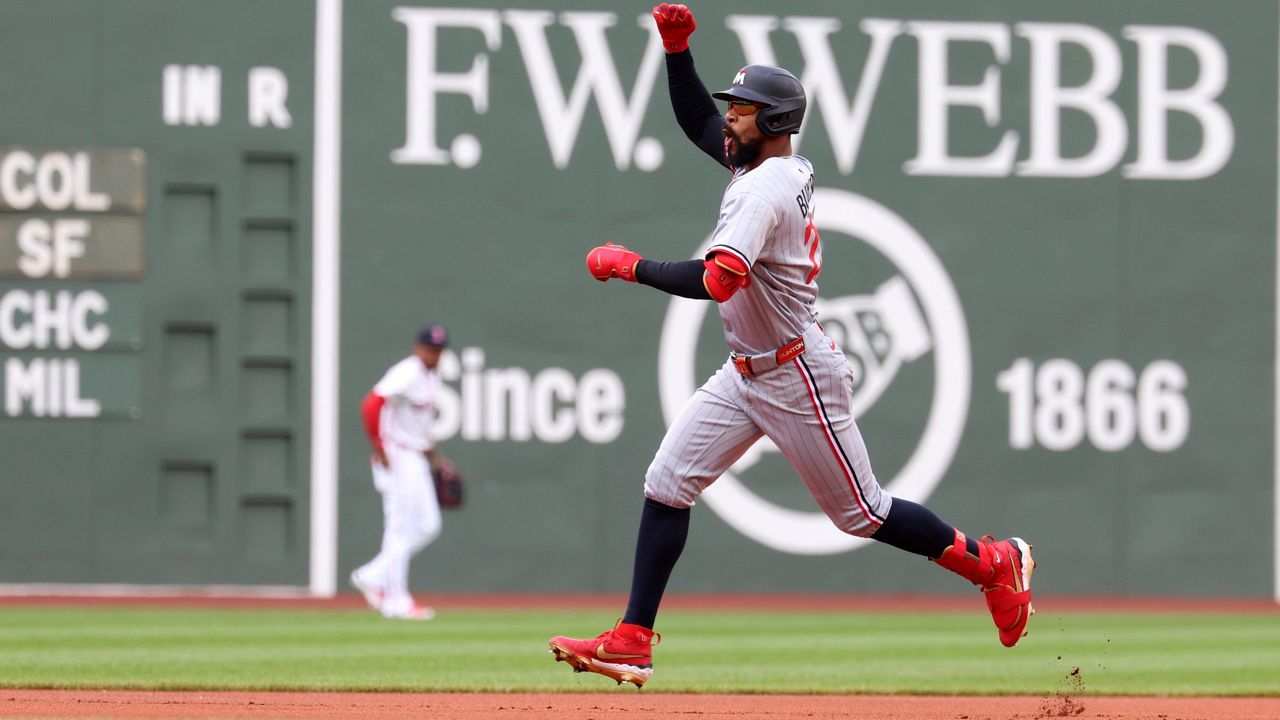 Minnesota Twins' Byron Buxton gestures as he runs the bases after hitting a home run during the first inning of a baseball game against the Boston Red Sox, Sunday, May 4, 2025, in Boston. (AP Photo/Mark Stockwell)
