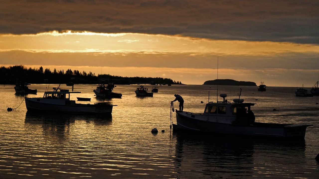 FILE- A lobstermen unties his boat before heading out to fish in Jonesport, Maine, April 27, 2023. (AP Photo/Robert F. Bukaty, File)