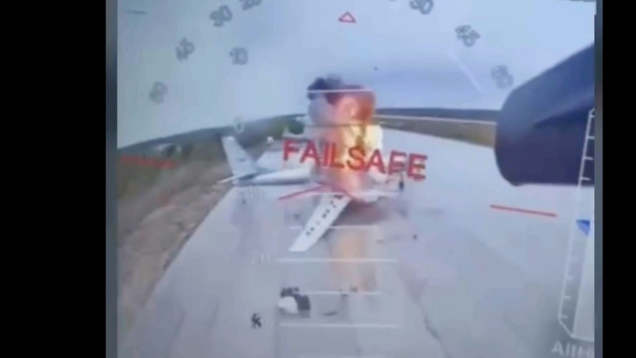 In this image taken from video released June 1, 2025, by a source in the Ukrainian Security Service shows a Ukrainian drone striking Russian planes deep in Russia's territory. (Source in the Ukrainian Security Service via AP)