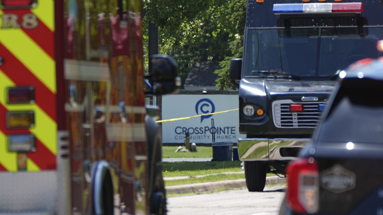 Emergency vehicles gather near CrossPointe Community Church in Wayne, Mich., Sunday, June 23, 2025. (AP Photo/Paul Sancya)