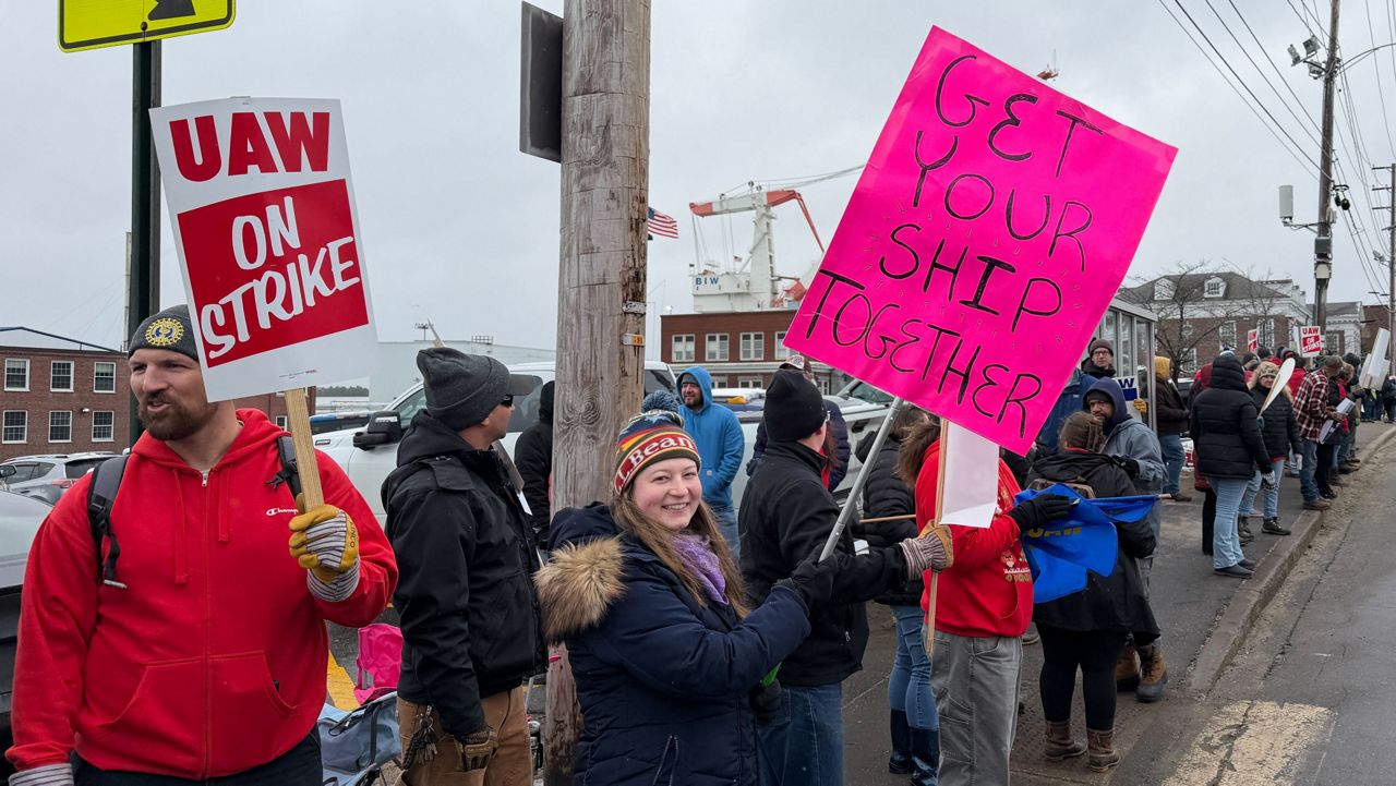 Strikers picketing outside Bath Iron Works in Bath, Maine, on Monday, May 23, 2026. (AP Photo/Rodrique Ngowi)