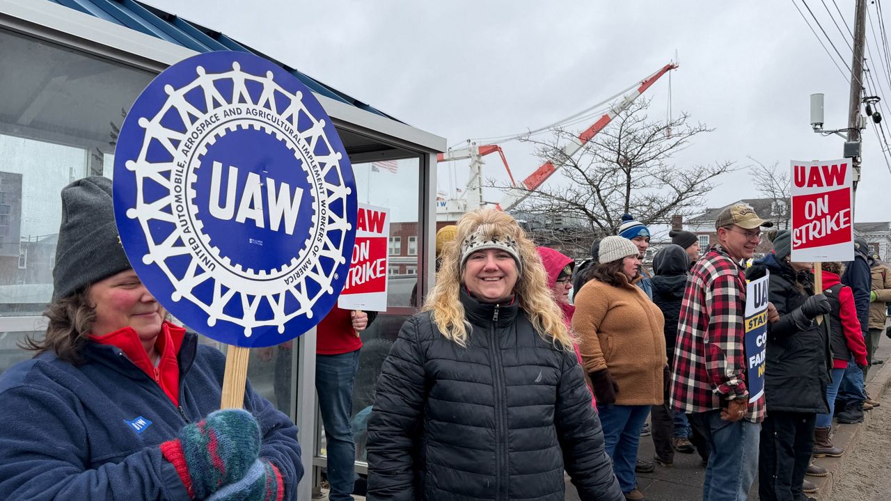 Strikers picketing outside Bath Iron Works in Bath, Maine, on Monday, May 23, 2026. (AP Photo/Rodrique Ngowi)
