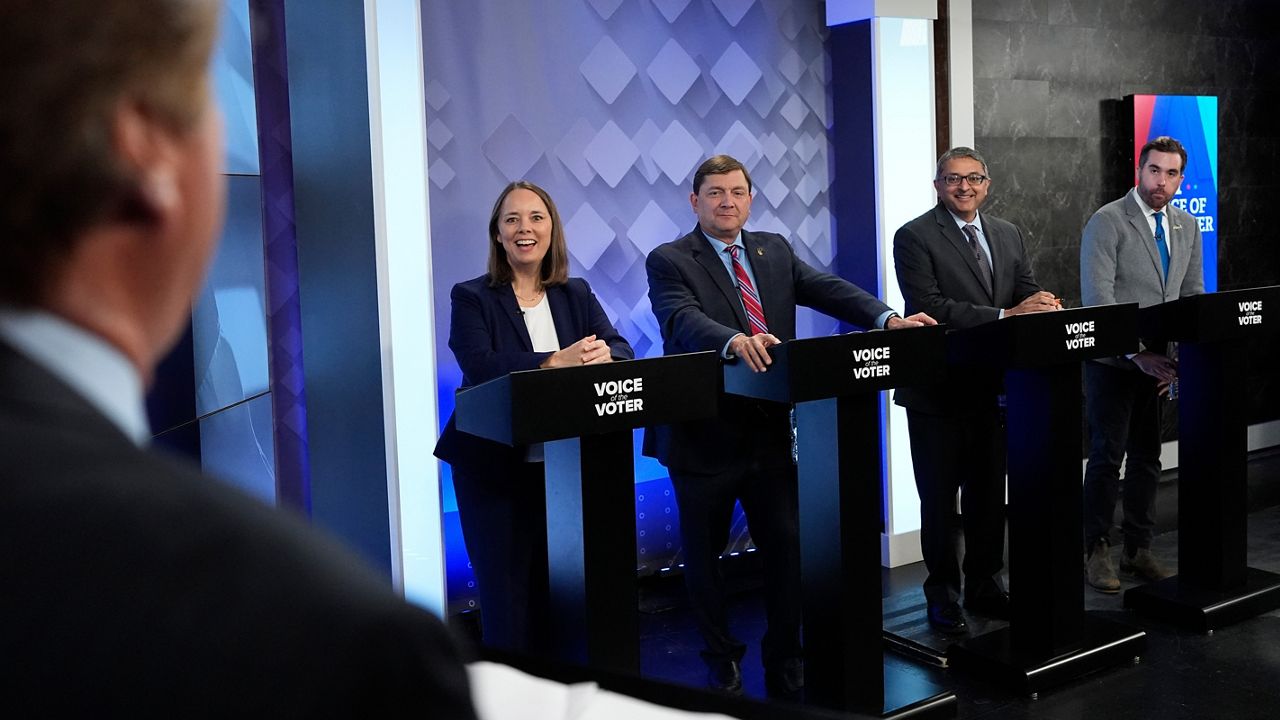 From podium left, U.S. Senate candidates Shenna Bellows, Troy Jackson, Dr. Nirav Shah, and Jordan Wood talk with moderator Phil Hirschkorn at WCSH-6 before a televised debate at the WCSH-6 studio Thursday, July 16, 2026, in Portland, Maine. (AP Photo/Robert F. Bukaty)