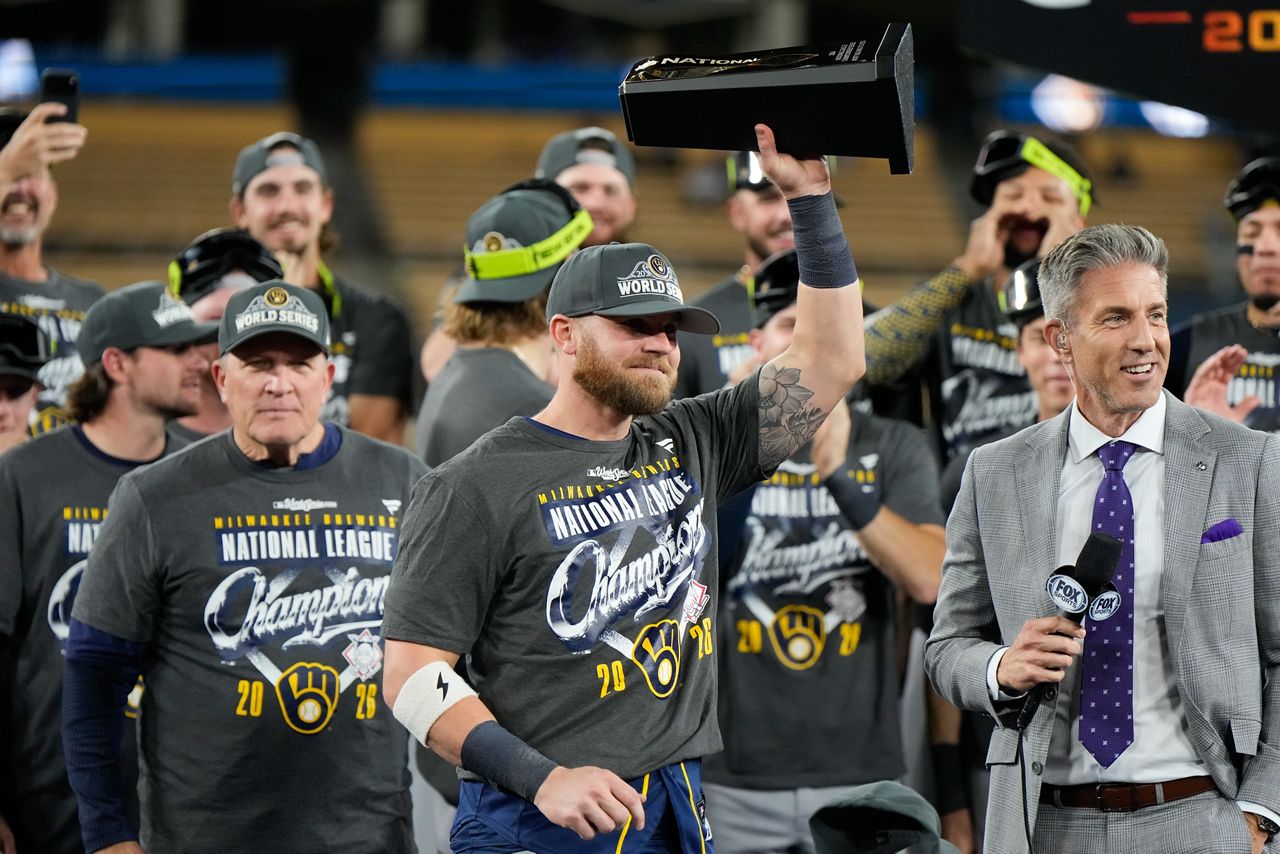 Jake Bauers holds the NLCS MVP trophy after Milwaukee swept the Dodgers in October 2026
