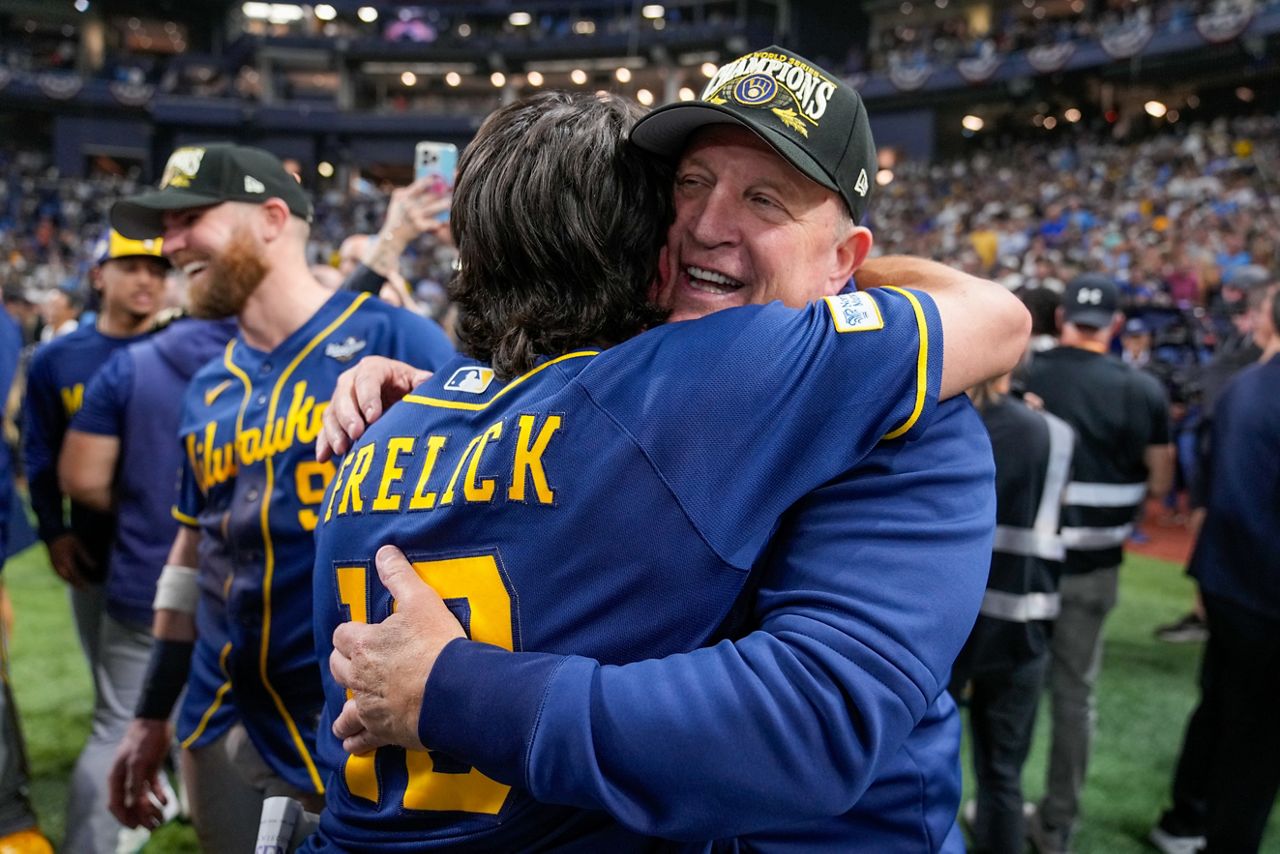 Brewers manager Pat Murphy hugs outfielder Sal Frelick after the championship win
