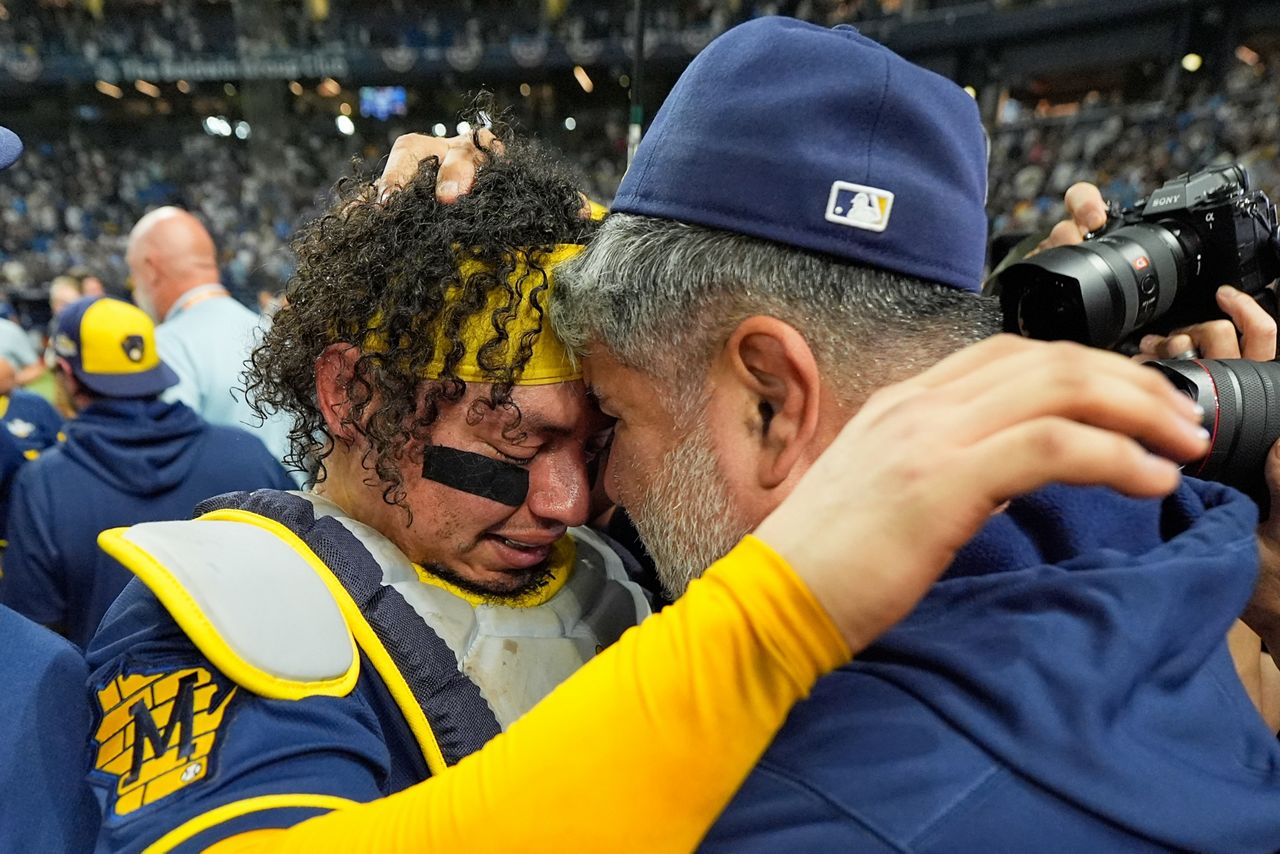 William Contreras embraces Brewers manager Pat Murphy after the 2026 World Series
