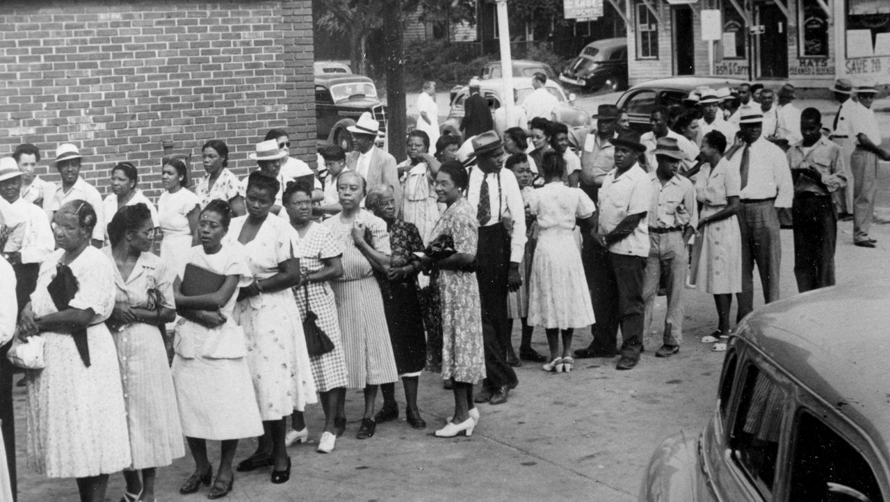 Black Americans line up to receive ballots at Columbia, S.C. on Aug. 10, 1948.