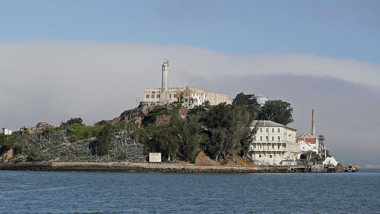 FILE — Fog lingers behind Alcatraz Island Wednesday, July 1, 2015, in San Francisco. (AP Photo/Eric Risberg)