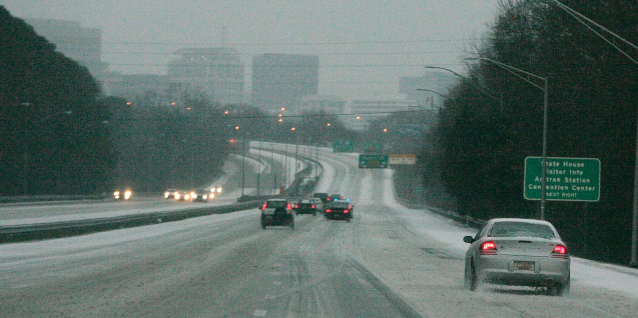 Ice and snow cover Interstate 26, early Wednesday, Feb. 12, 2014, in Columbia, S.C. (AP Photo/Mary Ann Chastain)