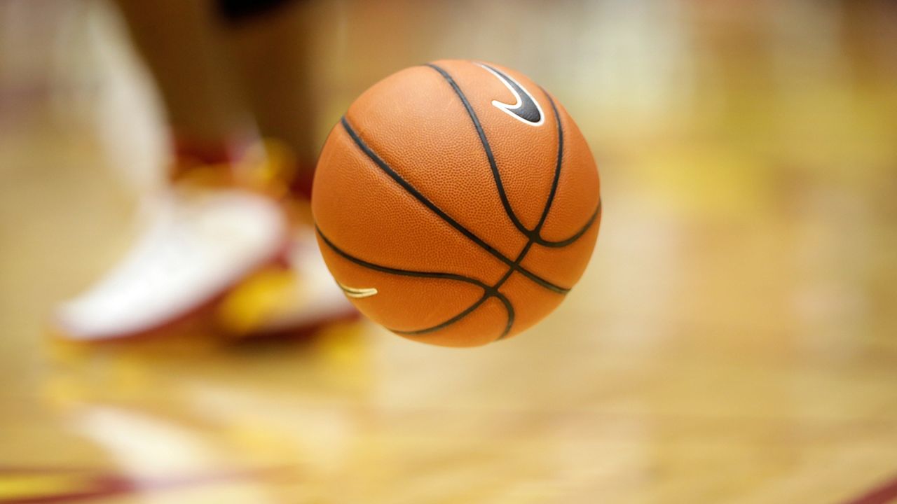 A basketball bounces on the court before an NCAA college basketball game between Iowa State and TCU, Saturday, Feb. 20, 2016, in Ames, Iowa. (AP Photo/Charlie Neibergall)