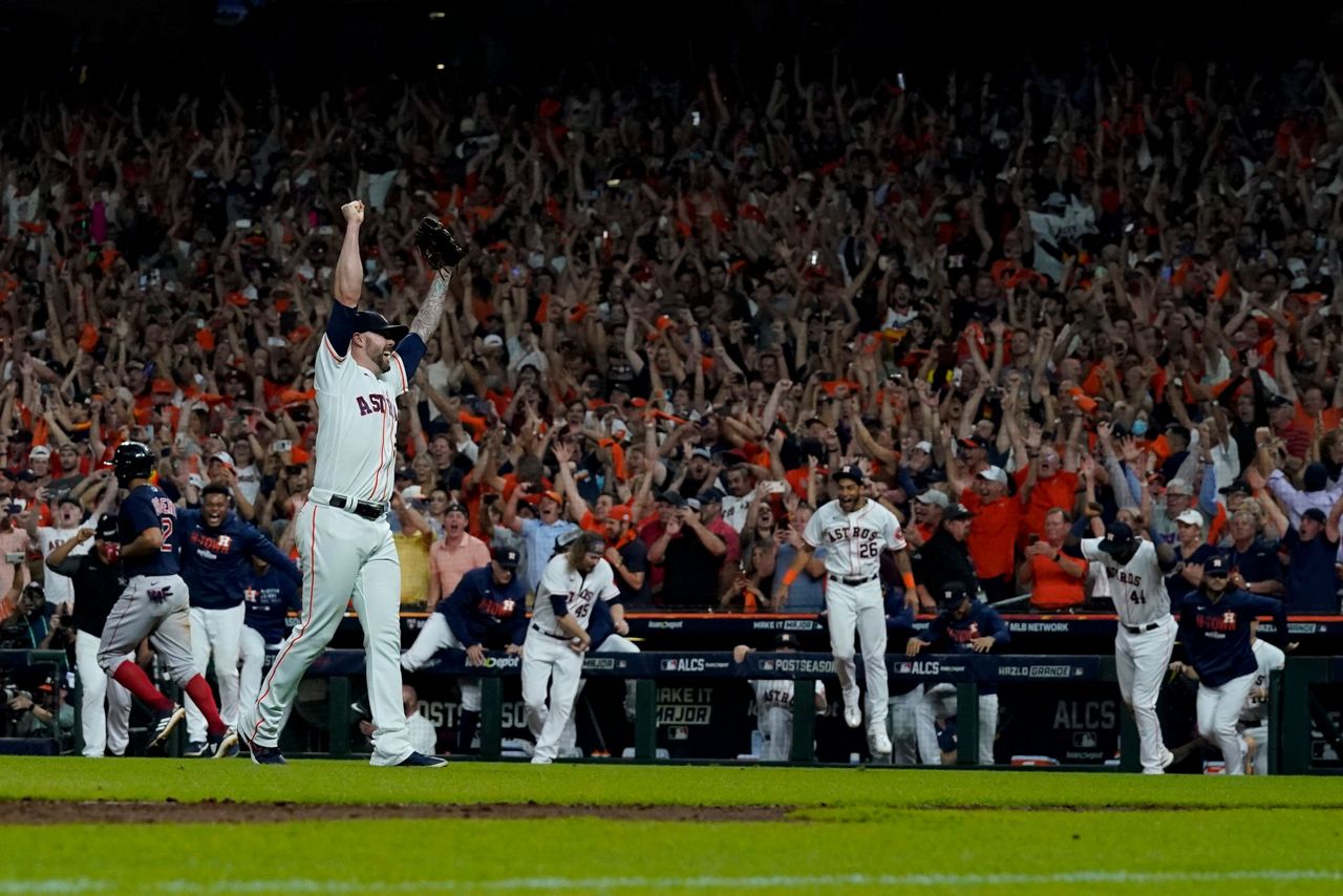 Luis Garcia of the Houston Astros looks on from the dugout before