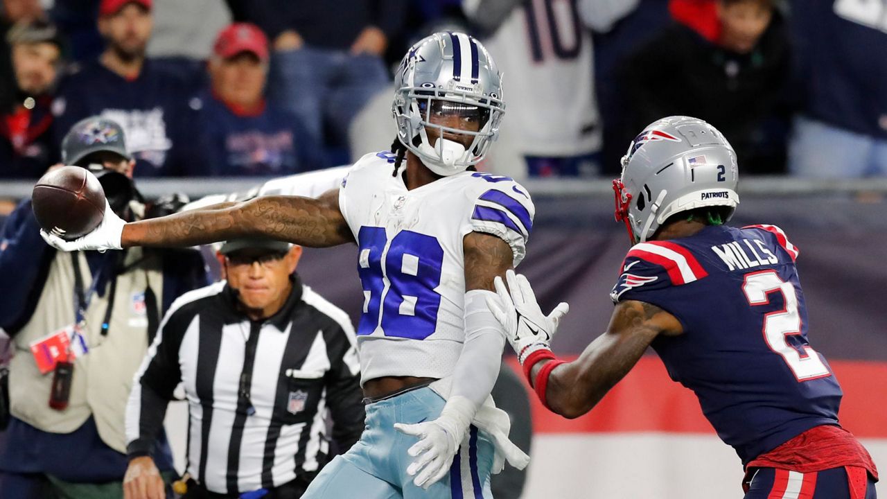 Dallas Cowboys quarterback Dak Prescott hits a wide-open Cowboys running  back Ezekiel Elliott for a walk-in touchdown pass