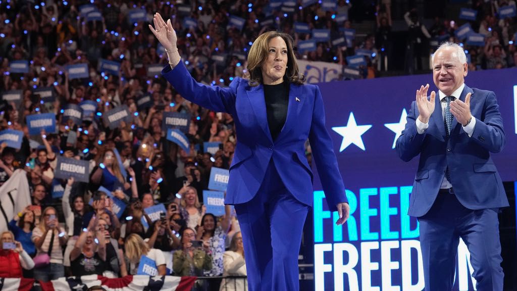 Democratic presidential nominee Vice President Kamala Harris arrives with running mate Minnesota Gov. Tim Walz at the Fiserv Forum during a campaign rally in Milwaukee, Tuesday, Aug. 20, 2024. (AP Photo/Jacquelyn Martin)