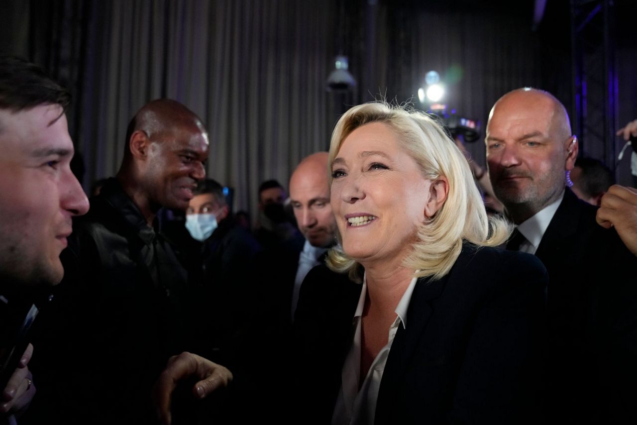 Beer flows, Champagne bubbles as Macron, Le Pen reach final