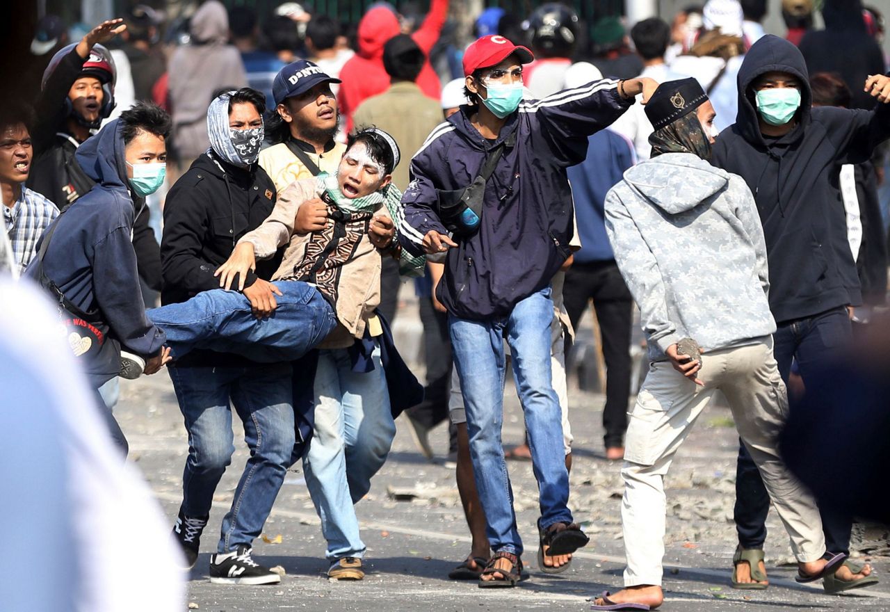 The Latest: Social media blocked due to Indonesia protests