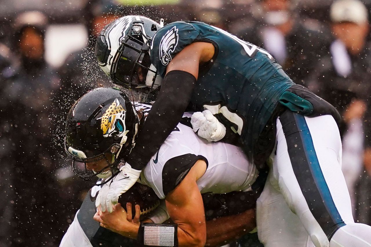 Jacksonville Jaguars' Jamal Agnew scores a touchdown in front of  Philadelphia Eagles' C.J. Gardner-Johnson during the first half of an NFL  football game Sunday, Oct. 2, 2022, in Philadelphia. (AP Photo/Matt Rourke