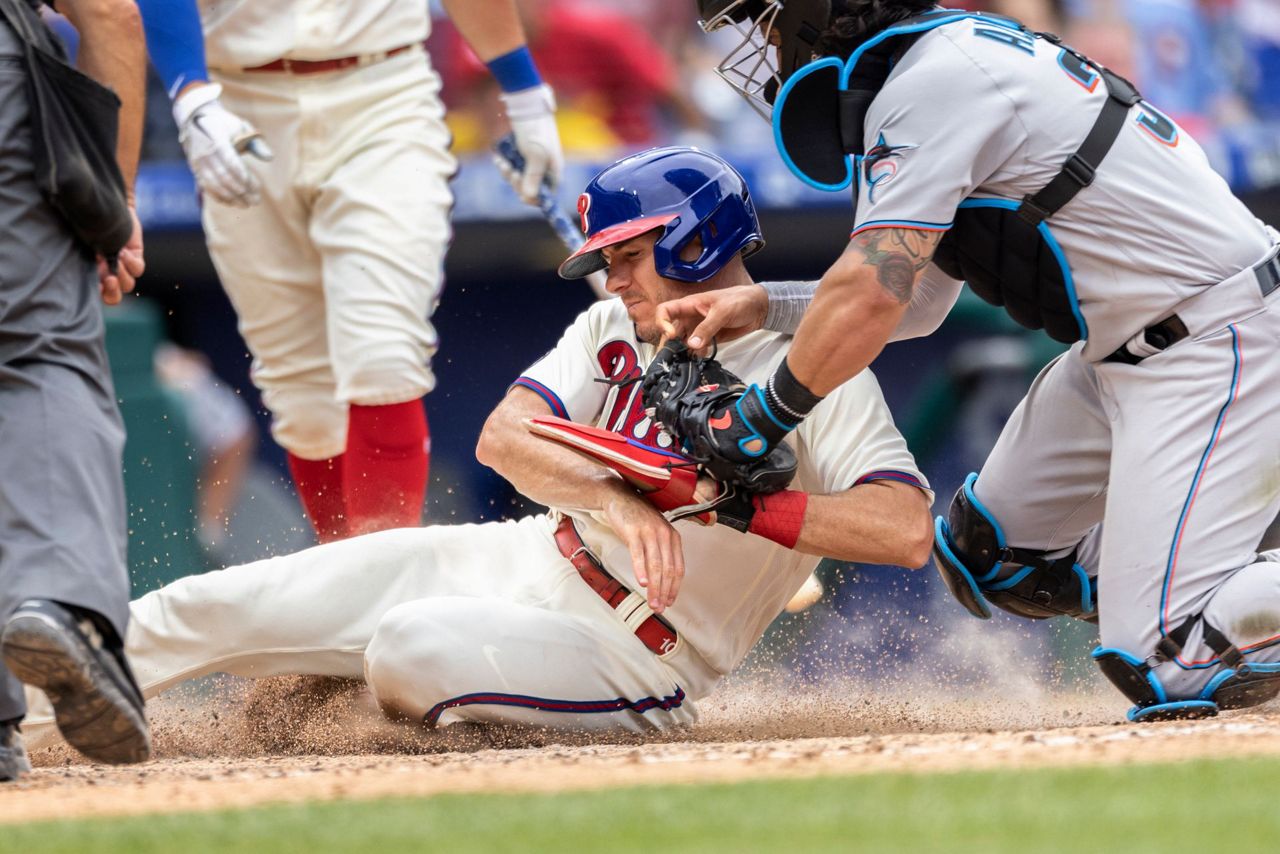 Miami Marlins' Jorge Alfaro is hit by a pitch during the ninth