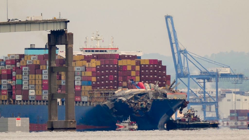 Tugboats escort the cargo ship Dali after it was refloated in Baltimore, Monday, May 20, 2024. (AP Photo/Matt Rourke)