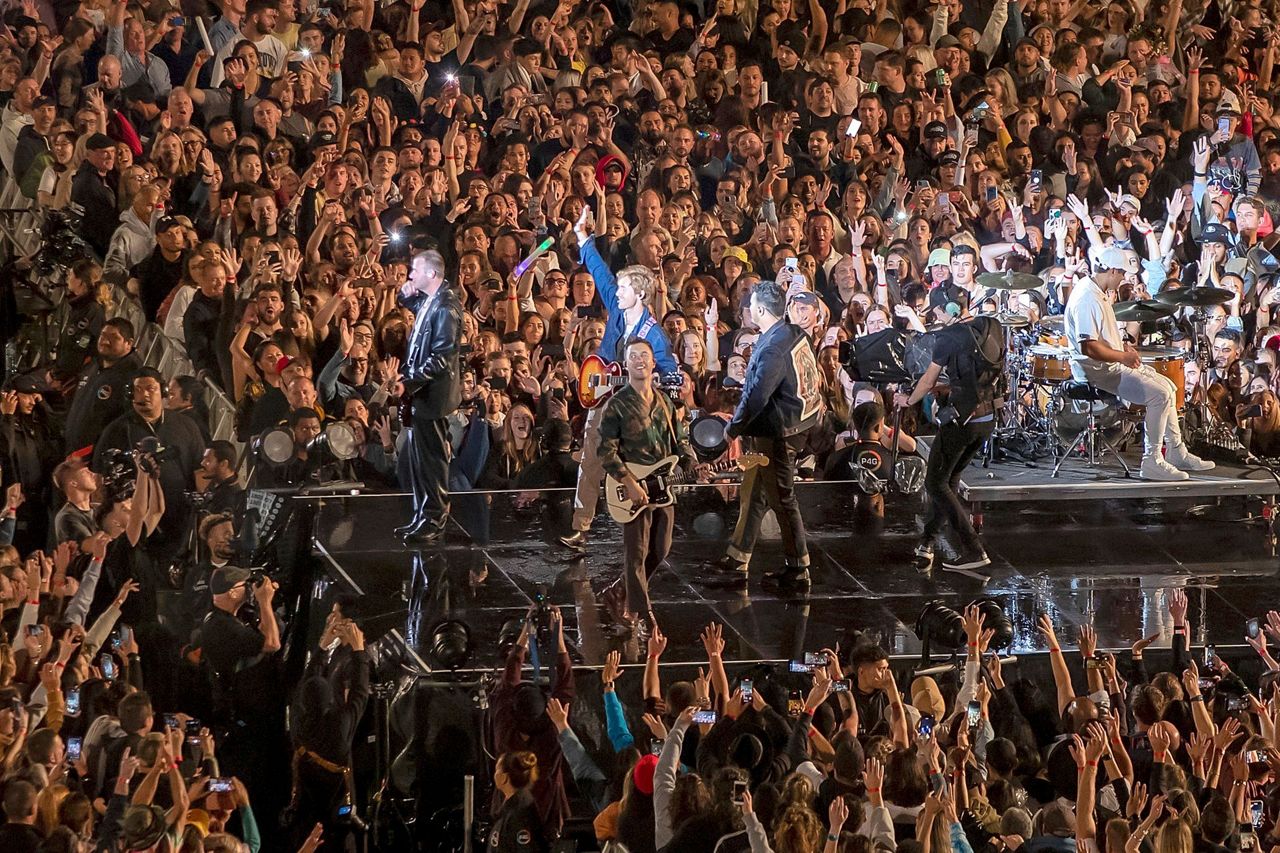 The world isolates. A New Zealand band plays to 50,000 fans