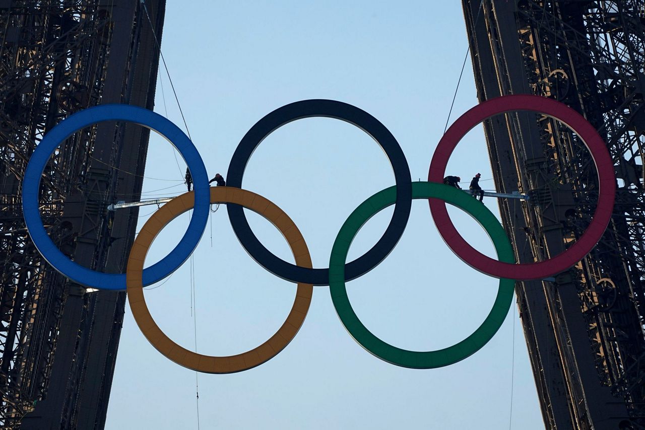 Paris Olympics organizers unveil a display of the five Olympic rings ...