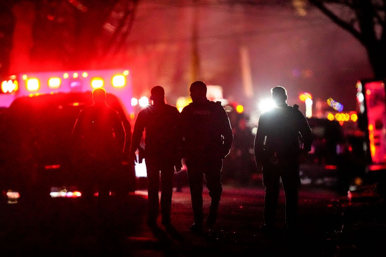 2 officers wounded by gunfire at home later seen on fire in ...