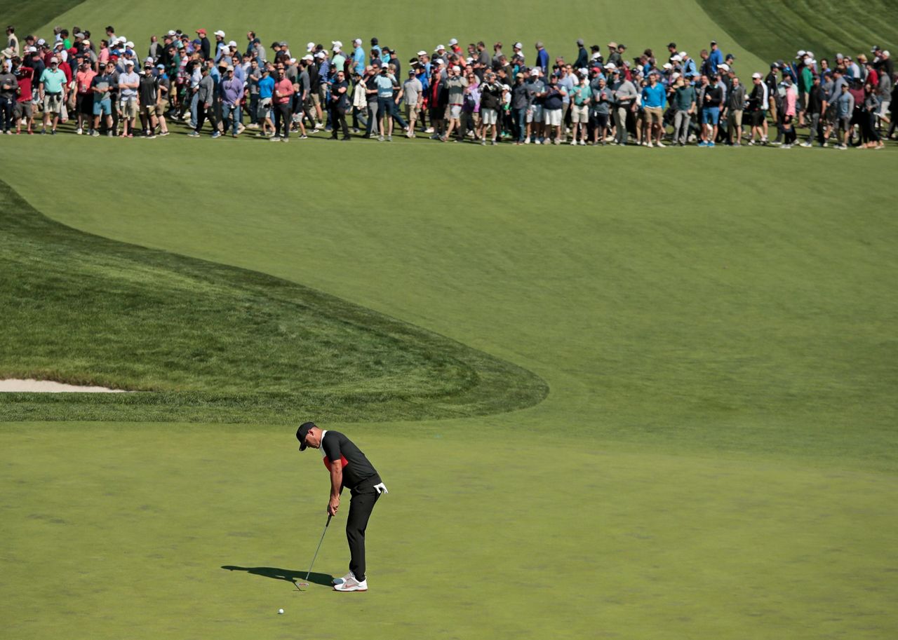 The Latest McIlroy needs rally and stumbles at start