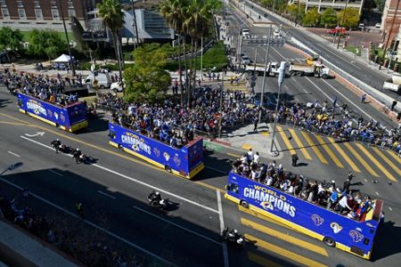 Los Angeles Rams offensive lineman Andrew Whitworth holds up the Vince  Lombardi Super Bowl trophy during the team's victory parade in Los Angeles,  Wednesday, Feb. 16, 2022, following their win Sunday over